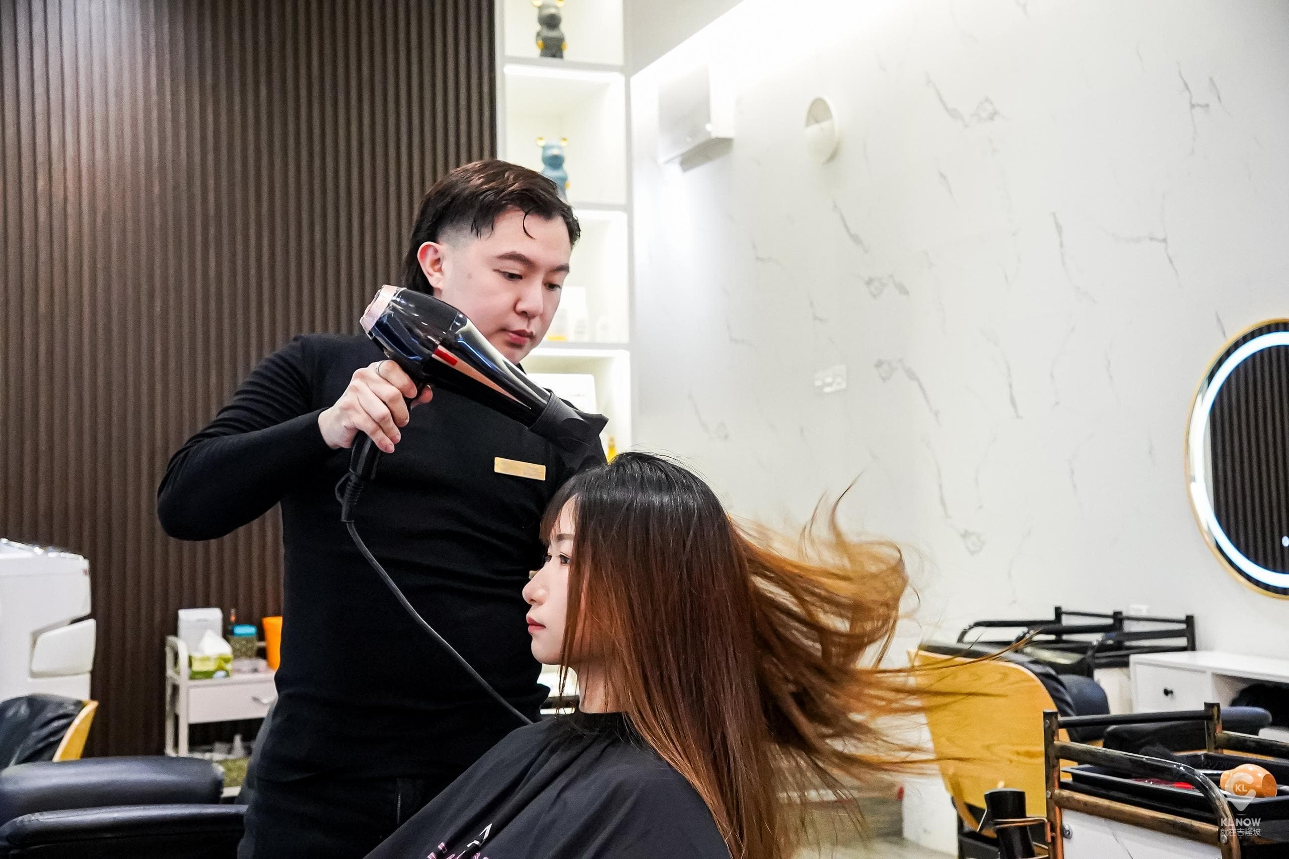 Founder Melcoln Lau blow-drying and styling a client at Hairdo Hub by Mel, Sungei Wang Plaza, Bukit Bintang, Kuala Lumpur